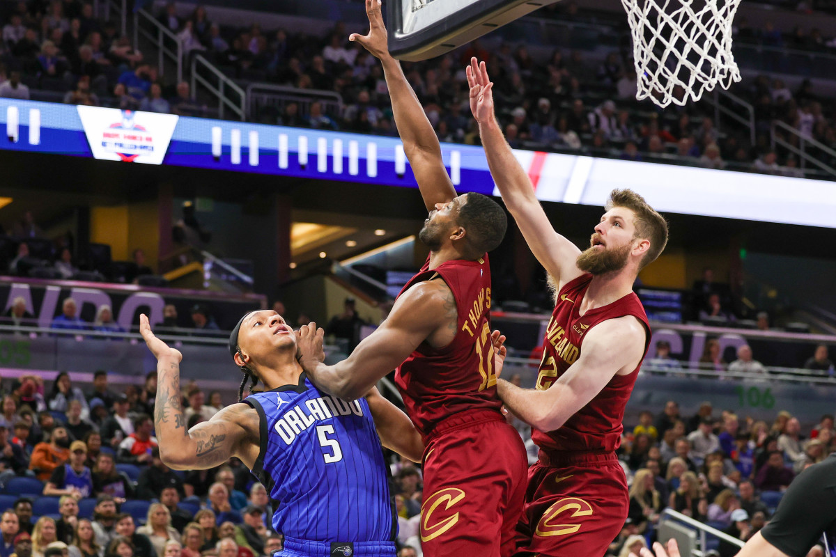 Orlando Magic forward Paolo Banchero (5) is fouled by Cleveland Cavaliers center Tristan Thompson (12) during the second half at Amway Center.